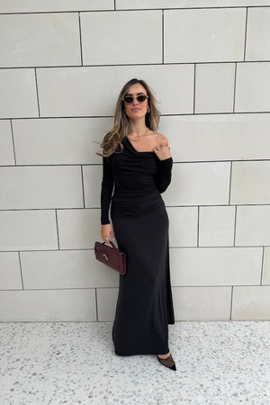 Hunter Maxi Skirt Black by Sneaky Link – Flattering gathered waistband and flared hem create a graceful silhouette. Perfect for trendy day-to-night viral style.