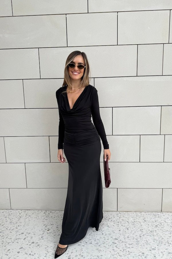 Hunter Maxi Skirt Black by Sneaky Link – Flattering gathered waistband and flared hem create a graceful silhouette. Perfect for trendy day-to-night viral style.