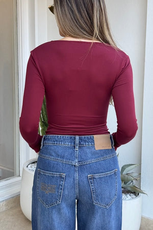 Haley Long Sleeve Top Burgundy by Sneaky Link – Trendy and sultry, this buttery-soft modal blend top features a low neckline with structured wire, perfect for chic nights out.