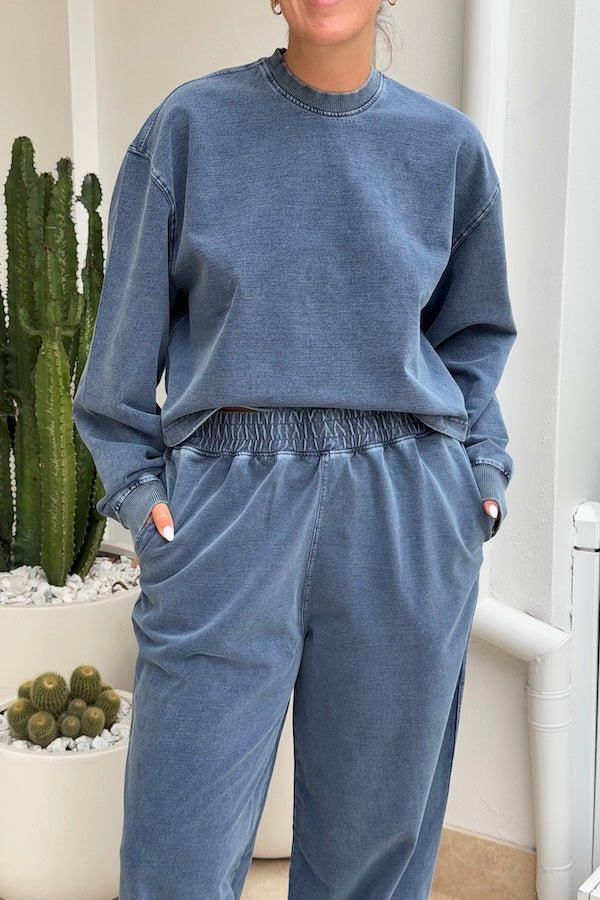 Dovell Crew Indigo by Camilla and Marc, denim fleece with saddle stitching and adjustable hem, perfect for casual days or trendy streetwear layering.