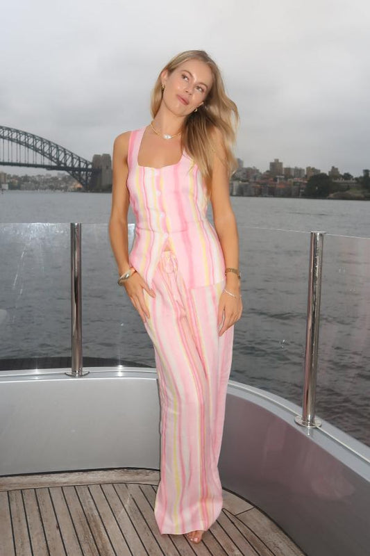 Isla Linen Top Pink Stripe by Sneaky Link – Trendy and breezy, this hand-painted linen top features a square neckline and waist ties, perfect for chic summer days or casual outings.