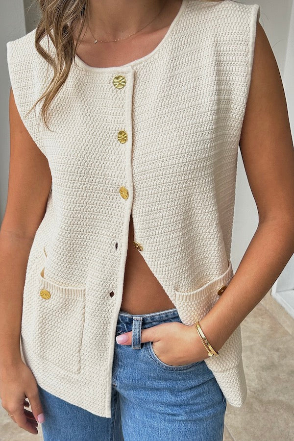 Helena Gilet Ivory by Onte, breathable cotton crochet knit with gold buttons and patch pockets, perfect for trendy layering and elegant casual wear.