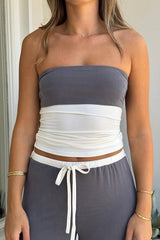 Hunter Tube Top Steel/Ivory by Sneaky Link – Sleek strapless top with contrast neckline and ruched sides. Perfect for trendy coordinated looks and viral summer vibes.