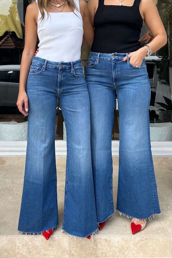 The Roller Fray Work Hard Play Hard by Mother, high-waisted wide-leg jeans with a 31-inch inseam and frayed hem, perfect for casual, trendy looks.