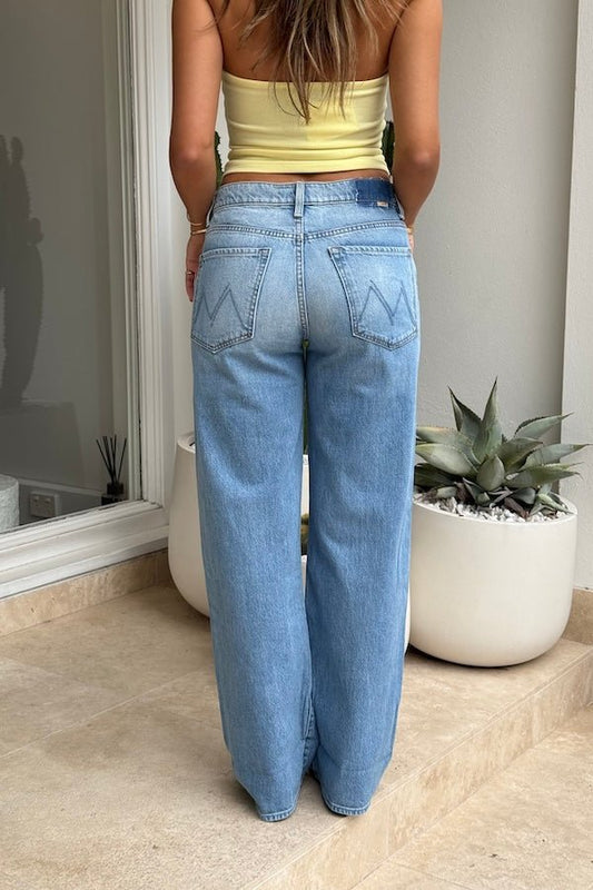 The Dodger Button Hover Cuff Funk N'Flair by MOTHER, trendy low-rise jeans with a slouchy fit, loose straight leg, and vintage-inspired details. Perfect for a relaxed, worn-in look with whiskering, knee fading, and a cuffed hem.