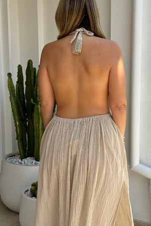 NEW Artemis Dress Sand by D'Artemide – Cotton halter dress with cutout, front split, cold hand wash, and delicate boho style.