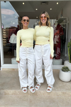 Brooklyn Top Yellow by Mossman – Trendy lightweight knit with high round neck, thumb holes, and longline fit. Perfect for layering and casual chic days.