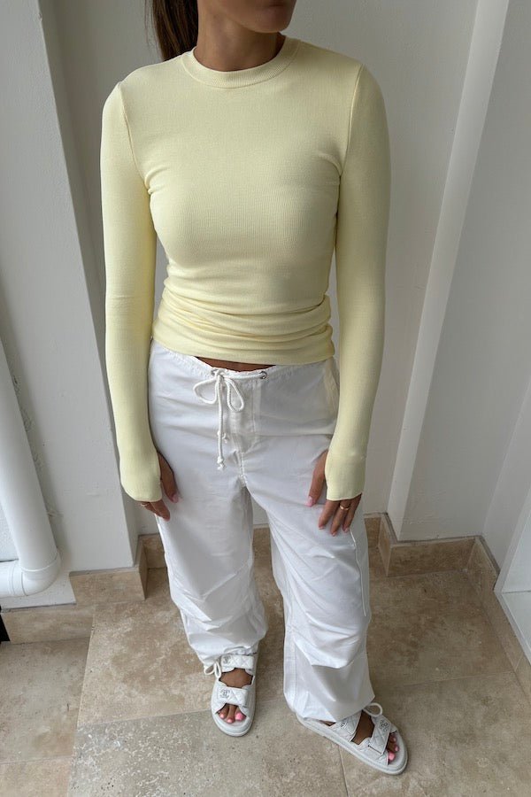 Brooklyn Top Yellow by Mossman – Trendy lightweight knit with high round neck, thumb holes, and longline fit. Perfect for layering and casual chic days.