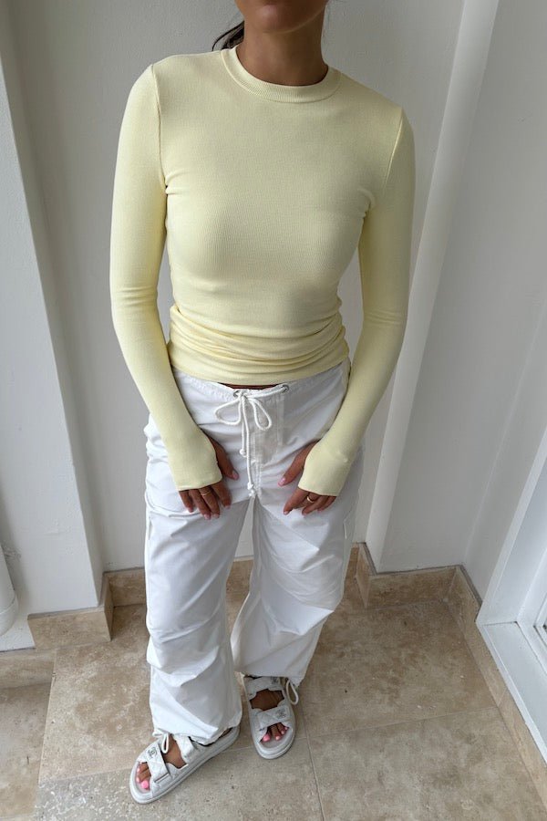 Brooklyn Top Yellow by Mossman – Trendy lightweight knit with high round neck, thumb holes, and longline fit. Perfect for layering and casual chic days.