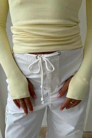 Brooklyn Top Yellow by Mossman – Trendy lightweight knit with high round neck, thumb holes, and longline fit. Perfect for layering and casual chic days.