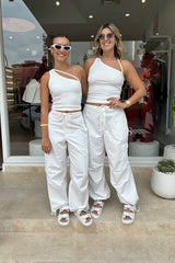 Cargo Link Pants White by Sneaky Link, versatile low-rise cargo pants with adjustable waist and hem ties for a laid-back or cuffed streetwear look.