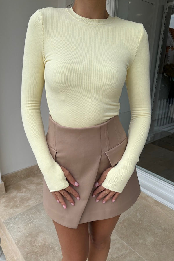 Sneaky Mini Skirt Latte by Sneaky Link – A-line high-waisted mini in bonded suiting with boned waist and mock pockets for chic all-day wear.