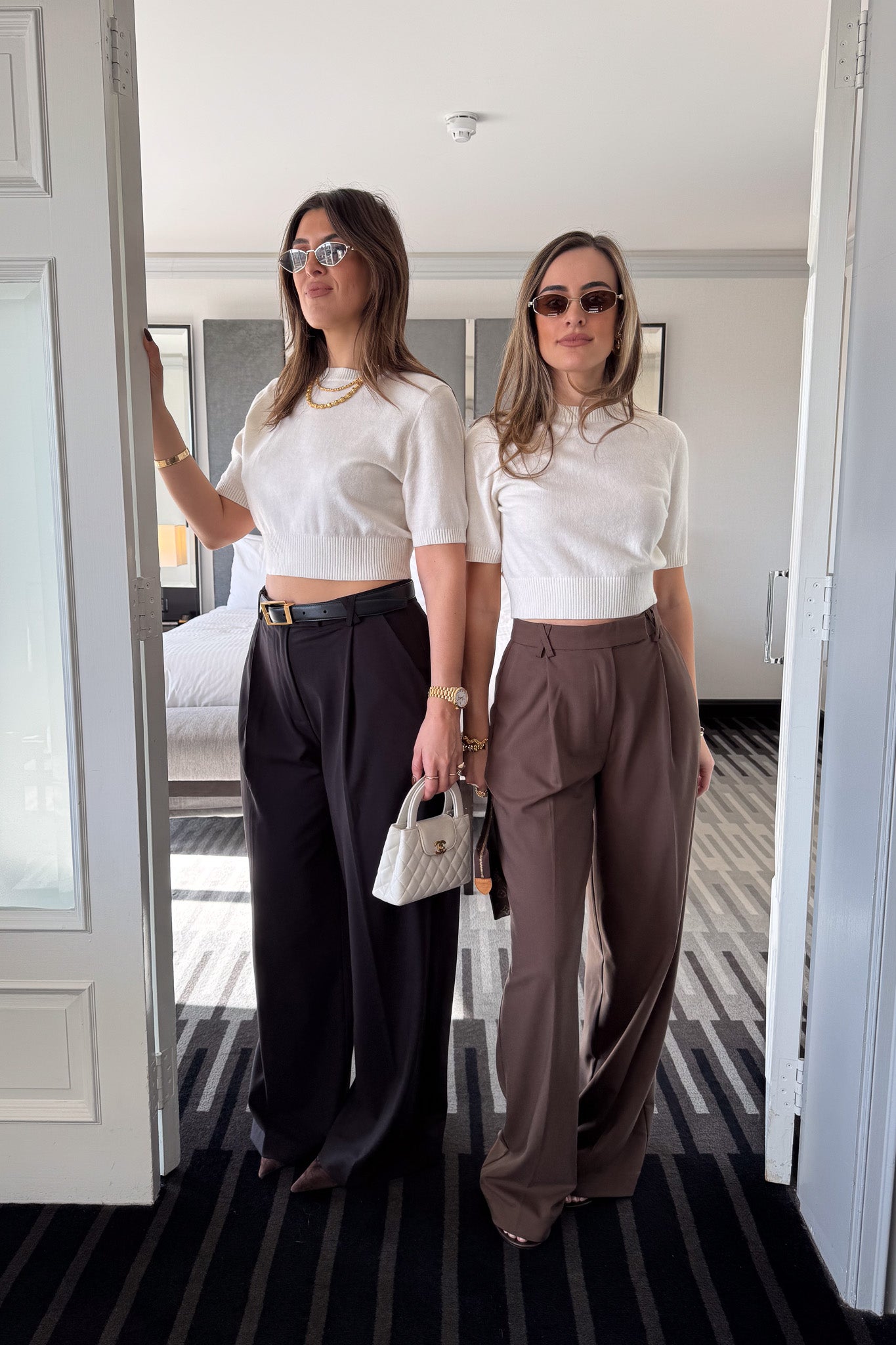 Kate Tailored Pant Black by Sneaky Link, high-waisted wide-leg pants crafted from luxe suiting fabric. Features waist tucks, pockets, and crossed belt loops for a modern, polished look.