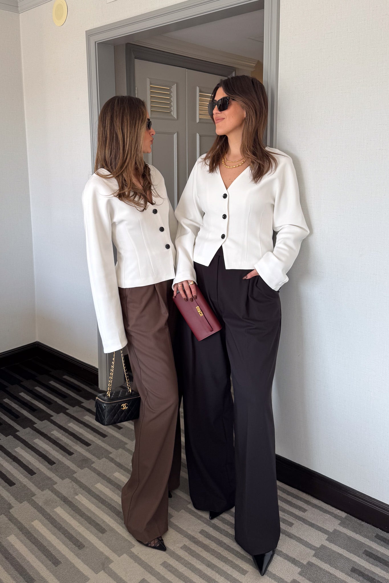 Kate Tailored Pant Black by Sneaky Link, high-waisted wide-leg pants crafted from luxe suiting fabric. Features waist tucks, pockets, and crossed belt loops for a modern, polished look.