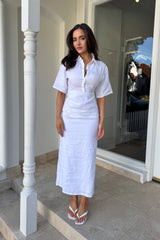 Lefka Midi Dress in White by Sneaky Link, linen midi with cinched waist, exaggerated sleeves, and feminine tummy ruching.