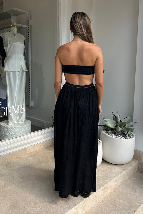 Chloe Dress Black by D'Artemide – A one-size cotton dress with ruched strapless top, side split, and relaxed low-back finish.