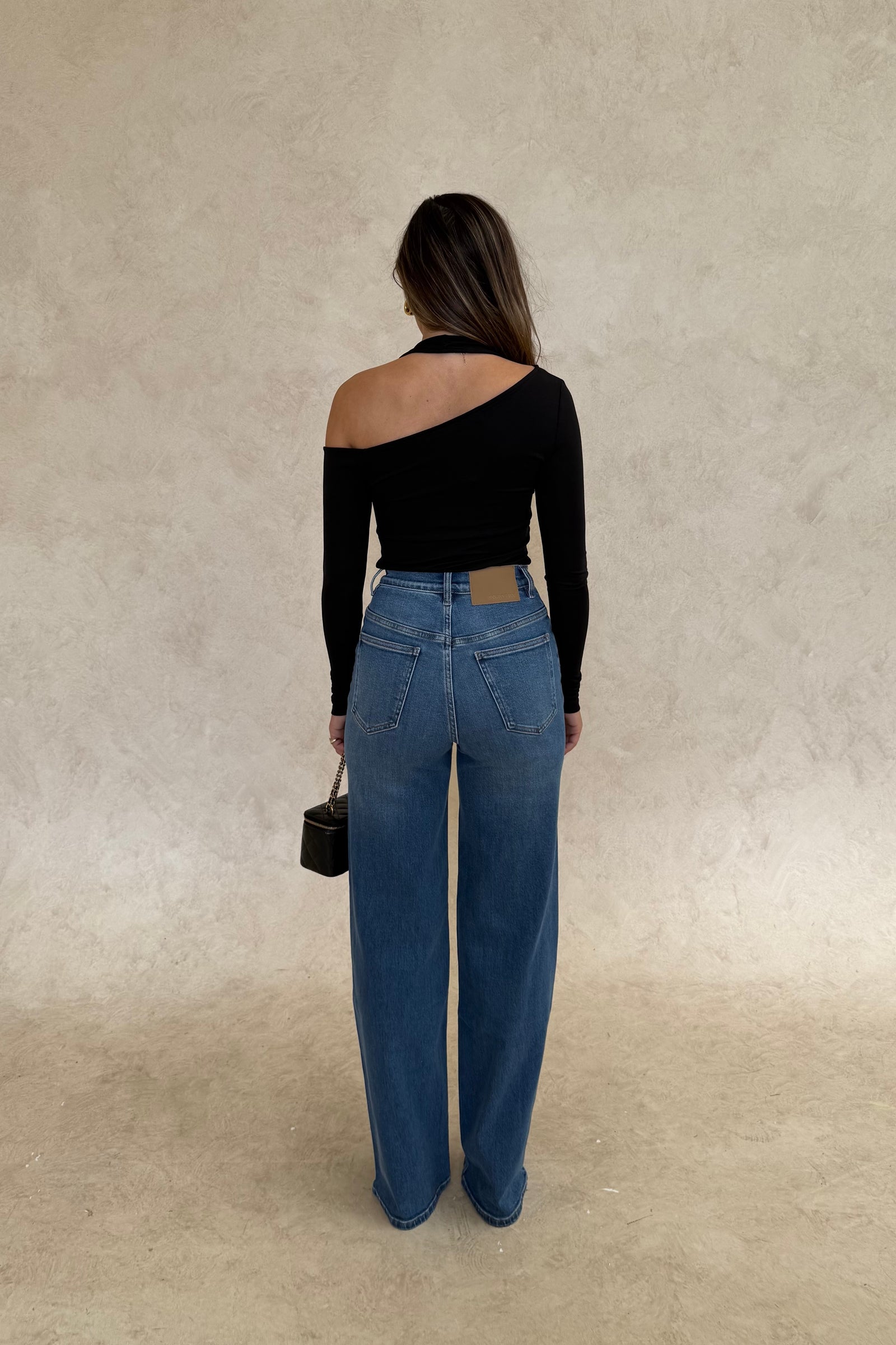 Celine High Rise Stretch Jean Indigo by Sneaky Link, high-stretch sculpting denim with a clean flare, elongating legs perfectly.