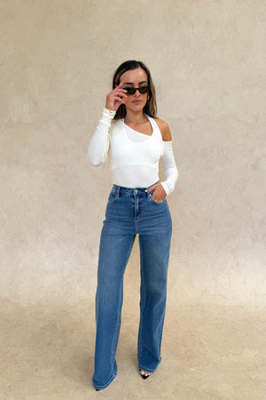 Celine High Rise Stretch Jean Indigo by Sneaky Link, high-stretch sculpting denim with a clean flare, elongating legs perfectly.