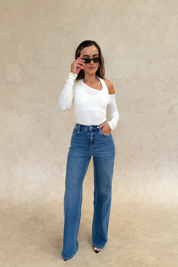 Celine High Rise Stretch Jean Indigo by Sneaky Link, high-stretch sculpting denim with a clean flare, elongating legs perfectly.