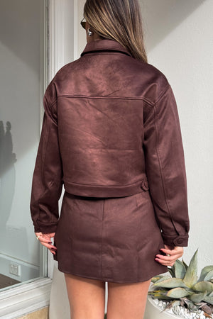 Dani Mini Skirt Chocolate by Sneaky Link, luxe faux suede A-line skirt with crossed belt loop detailing, perfect for co-ords or layering.