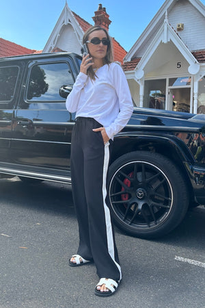 Long Sleeve Tee White by Sneaky Link – The ultimate capsule piece, this loose-fit 100% cotton tee is perfect for everyday wear. Lia wears M, Renee wears XS.