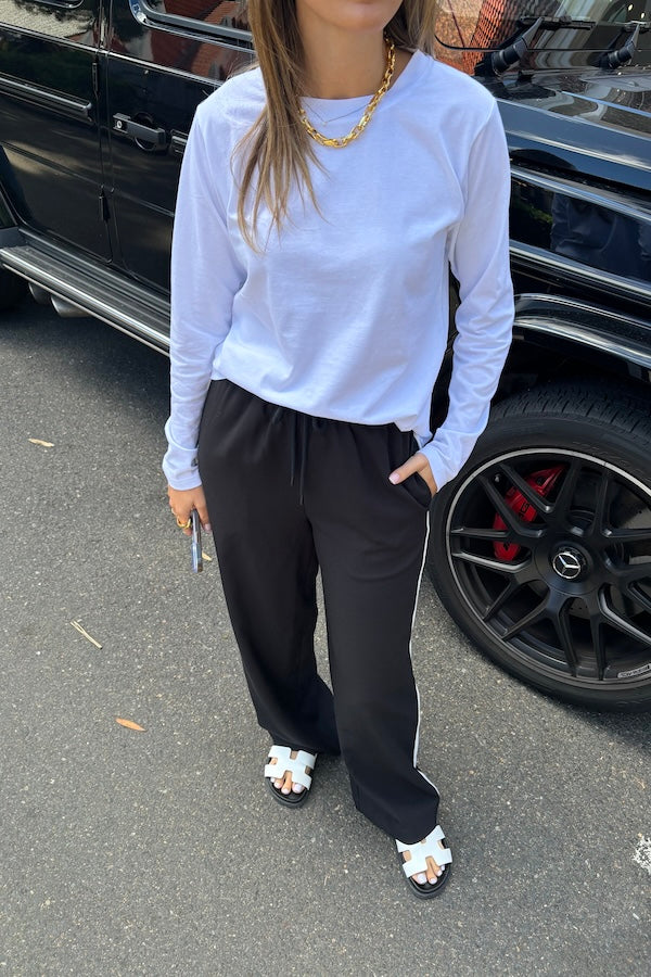 Long Sleeve Tee White by Sneaky Link – The ultimate capsule piece, this loose-fit 100% cotton tee is perfect for everyday wear. Lia wears M, Renee wears XS.