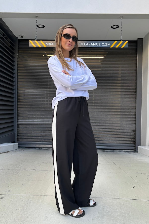 Long Sleeve Tee White by Sneaky Link – The ultimate capsule piece, this loose-fit 100% cotton tee is perfect for everyday wear. Lia wears M, Renee wears XS.