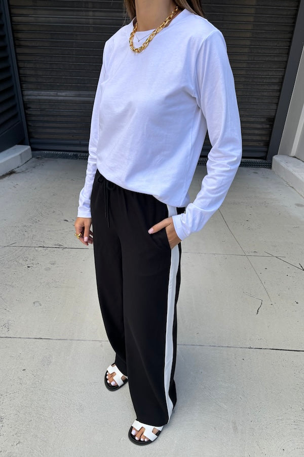 Long Sleeve Tee White by Sneaky Link – The ultimate capsule piece, this loose-fit 100% cotton tee is perfect for everyday wear. Lia wears M, Renee wears XS.