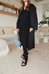 Evans Trench Coat Black by Camilla and Marc – oversized double-breasted trench with storm flaps and belt, perfect for chic layering across seasons.
