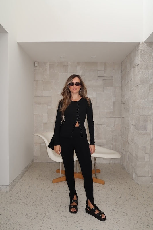 Exclusive Clements Pants by Camilla and Marc feature a slim, high-waisted fit crafted from a stretchy wool blend. Pintucks and press pleats elongate the legs, while tailored back welt pockets and darts ensure a structured silhouette.