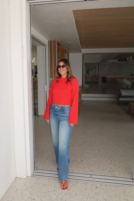 Claudia Long Sleeve Top Red by Sneaky Link – Soft cotton blend cropped tee with relaxed fit and long sleeves. Perfect for cozy autumn vibes and viral casual looks.