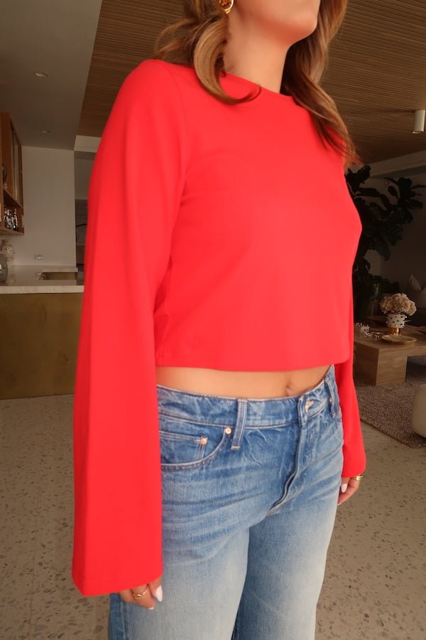 Claudia Long Sleeve Top Red by Sneaky Link – Soft cotton blend cropped tee with relaxed fit and long sleeves. Perfect for cozy autumn vibes and viral casual looks.