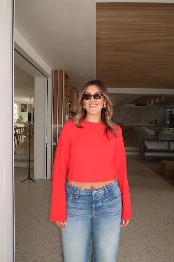 Claudia Long Sleeve Top Red by Sneaky Link – Soft cotton blend cropped tee with relaxed fit and long sleeves. Perfect for cozy autumn vibes and viral casual looks.