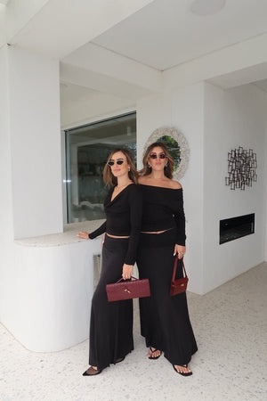 Hunter Maxi Skirt Black by Sneaky Link – Flattering gathered waistband and flared hem create a graceful silhouette. Perfect for trendy day-to-night viral style.