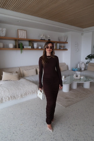 Caterina Midi Dress Chocolate by Sneaky Link – A sexy, cozy modal blend midi with ruched skirt and boat neckline, perfect for chic evening events and cooler nights.