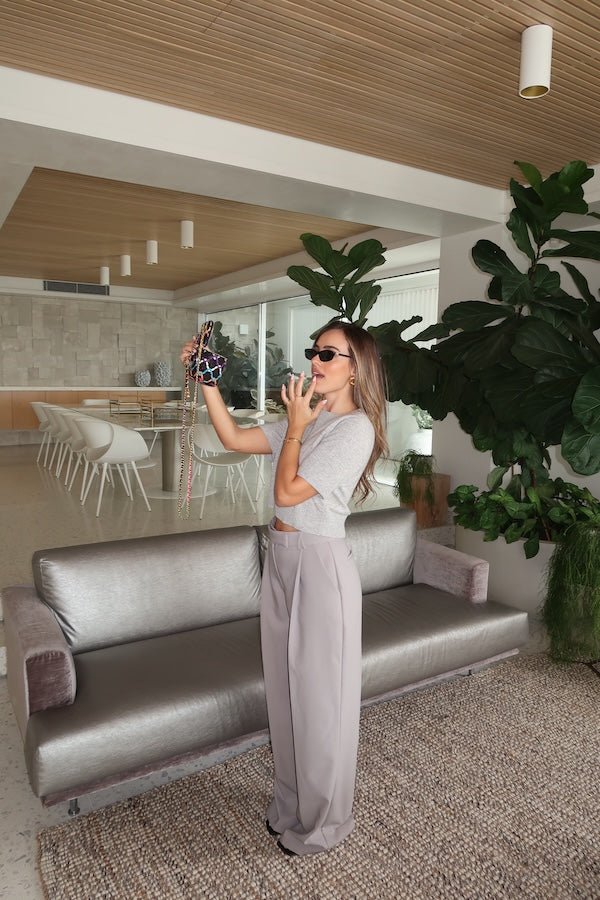 Niamh Knit Top Grey by Sneaky Link – Cropped knit tee with high scoop neck and ribbed details. Perfect for chic office looks or viral casual wear.