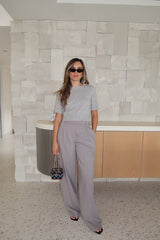 Niamh Knit Top Grey by Sneaky Link – Cropped knit tee with high scoop neck and ribbed details. Perfect for chic office looks or viral casual wear.