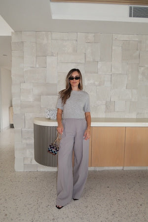 Niamh Knit Top Grey by Sneaky Link – Cropped knit tee with high scoop neck and ribbed details. Perfect for chic office looks or viral casual wear.