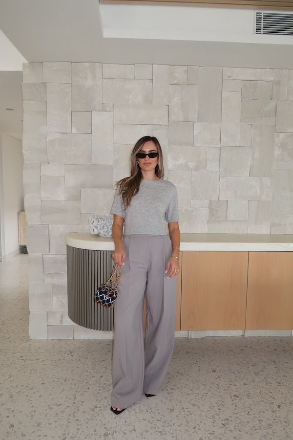 Niamh Knit Top Grey by Sneaky Link – Cropped knit tee with high scoop neck and ribbed details. Perfect for chic office looks or viral casual wear.