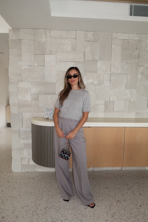 Niamh Knit Top Grey by Sneaky Link – Cropped knit tee with high scoop neck and ribbed details. Perfect for chic office looks or viral casual wear.