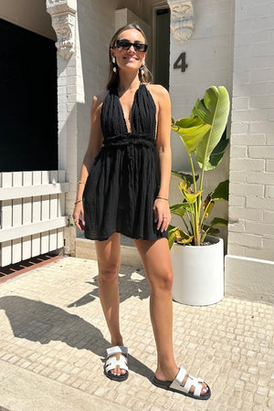 Lefkothea Mini Dress Black by D'Artemide – One-size cotton mini with halter tie, V neckline, and open back with cutouts.