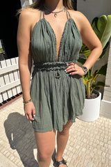 Lefkothea Mini Dress Khaki by D'Artemide – One-size cotton mini with halter tie, deep V neckline, low back, and side cutouts.