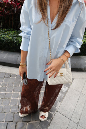 Jordi Lace Pant Chocolate by Sneaky Link, relaxed-fit lace pants with an elasticated waistband, scalloped hem, and sheer feminine detailing — perfect for effortless layering and chic day-to-night styling.