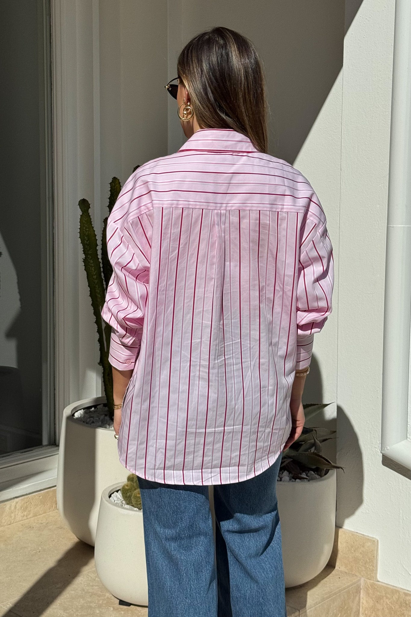 Boston Shirt Pink/Red Stripe by Sneaky Link, oversized cotton button-up with cuffed sleeves and signature snake embroidery for timeless, fresh style.