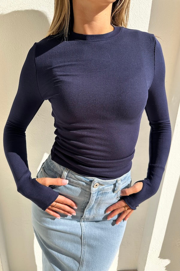 The Brooklyn Top Navy by Mossman, lightweight knitwear with a high round neckline and thumb sleeve openings, perfect for trendy layering and casual chic looks.