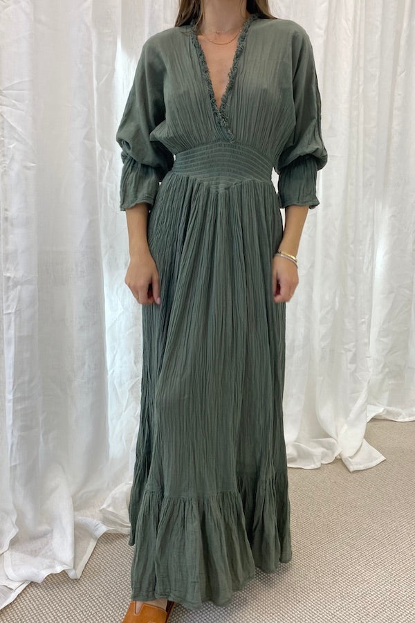 Eleni Dress Khaki by D'Artemide – One-size cotton dress with ruched waist, V neckline, and maxi skirt for chic all-day wear.