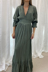 Eleni Dress Khaki by D'Artemide – One-size cotton dress with ruched waist, V neckline, and maxi skirt for chic all-day wear.