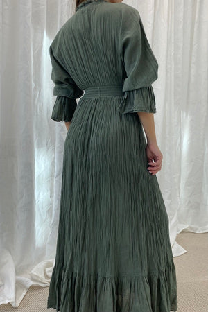 Eleni Dress Khaki by D'Artemide – One-size cotton dress with ruched waist, V neckline, and maxi skirt for chic all-day wear.