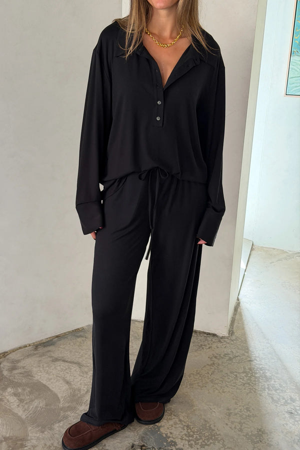 The Hunter Long Sleeve Polo Top in Black by Sneaky Link is a soft second skin essential with a flattering fit, polished collar, and easy everyday appeal.