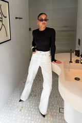 Black Yianni Layered Long Sleeve Top with a fitted silhouette and subtle layered detailing on the sleeves.4